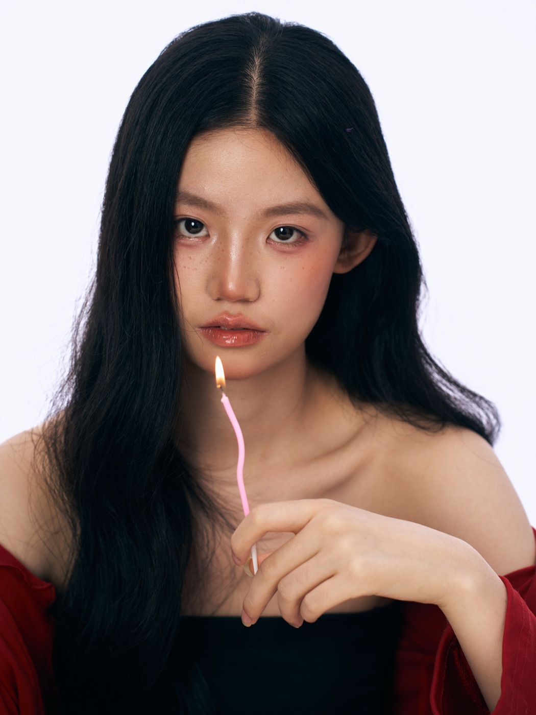 Portrait of Ziyue holding a lit candle
